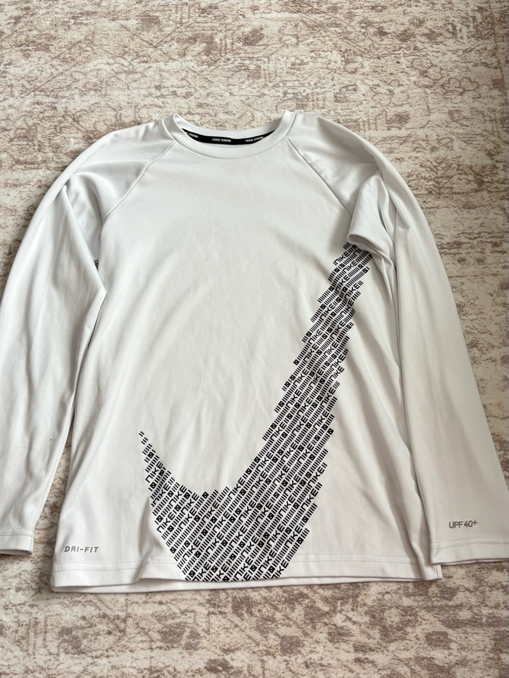 Nike White Long-Sleeve Dri-FIT Shirt with Black Swoosh Graphic